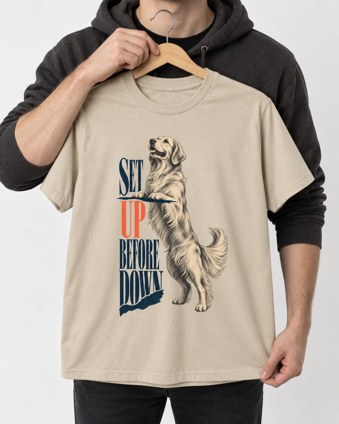 Golden Retriever Set Up Before Down T-Shirt in Sand, held up on a hanger