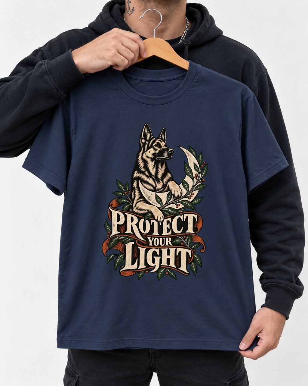 Protect Your Light Moon Botanical German Shepherd Dog Graphic T-Shirt in Navy, held up on a hanger