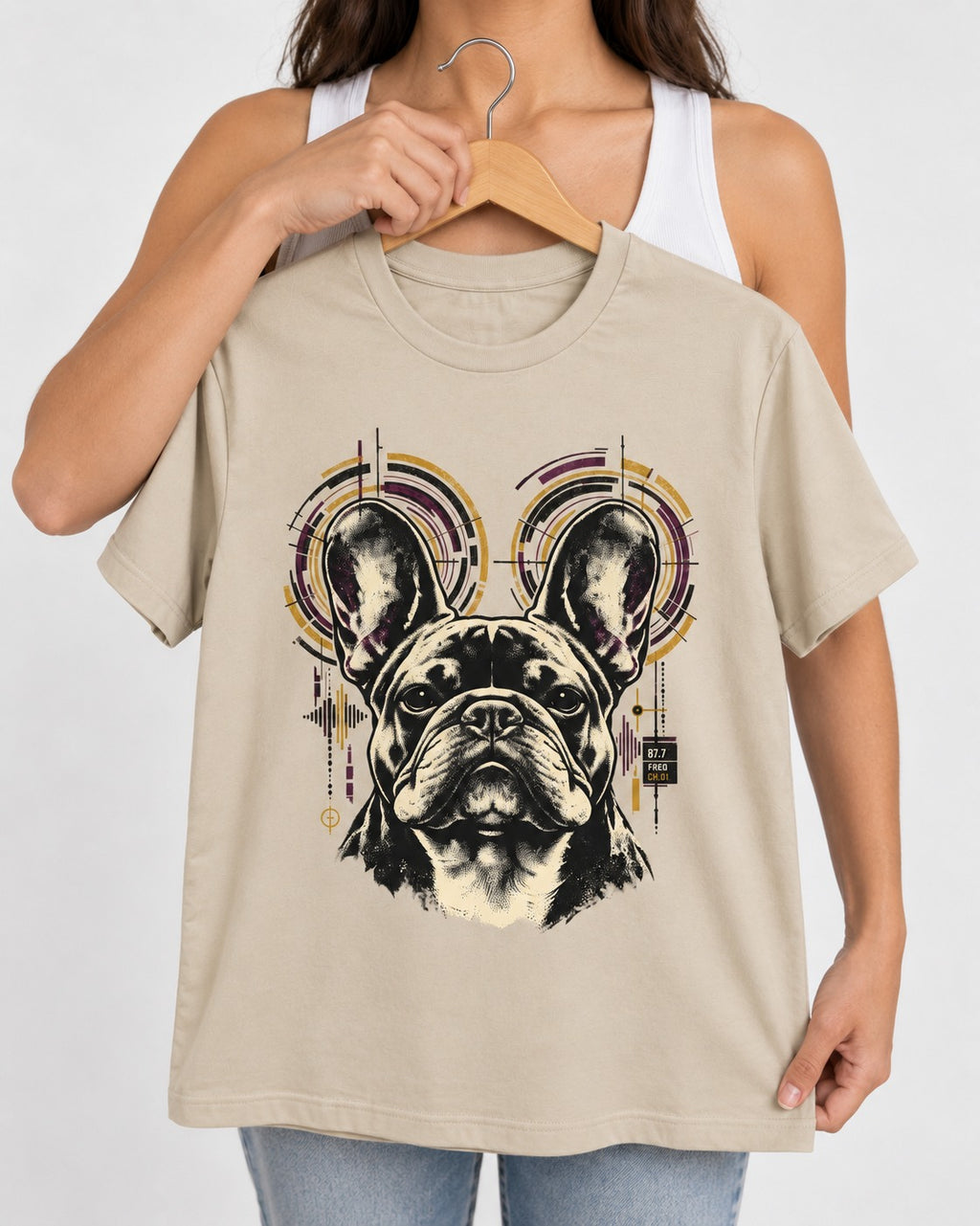 Frenchie Frequency T-Shirt in Sand, held up on a hanger
