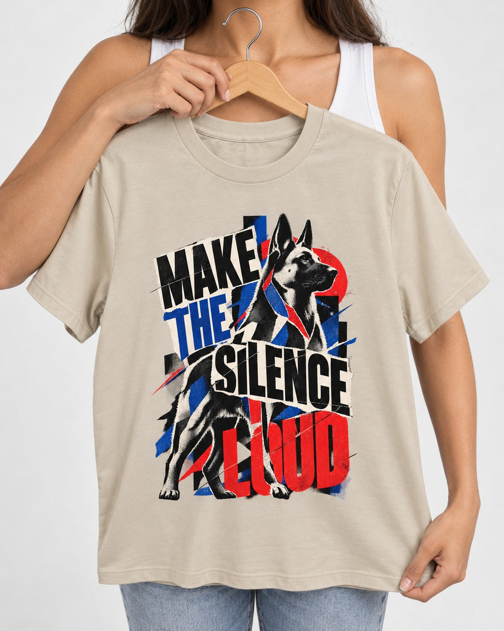 German Shepherd Dog Make the Silence Loud T-Shirt in Sand, held up on a hanger