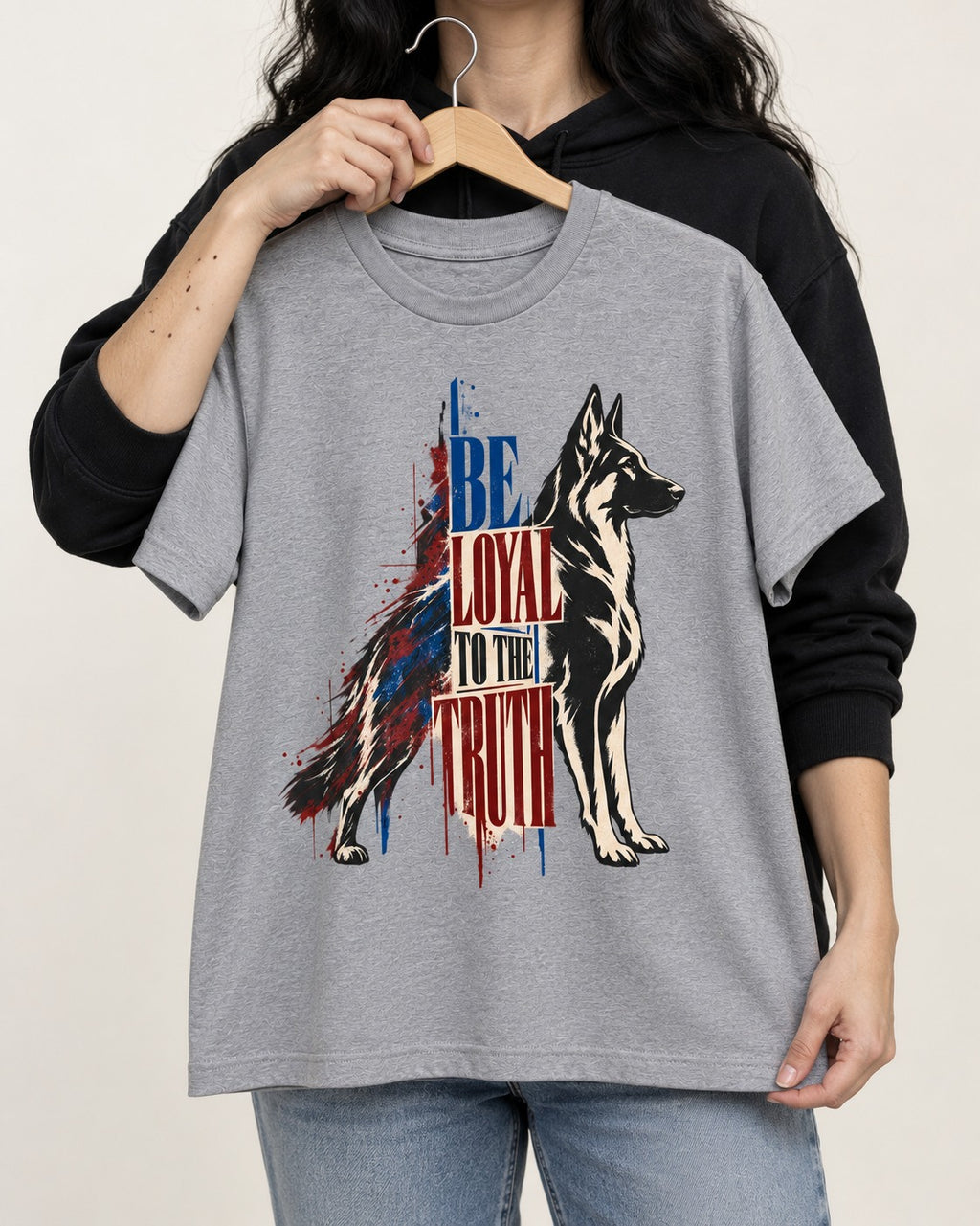 Loyal to the Truth German Shepherd Dog T-Shirt in Sport Grey, held up on a hanger
