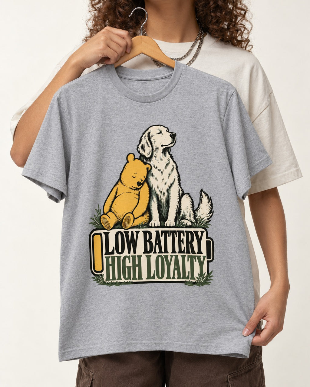 Golden Retriever Low Battery High Loyalty T-Shirt in Sport Grey, held up on a hanger
