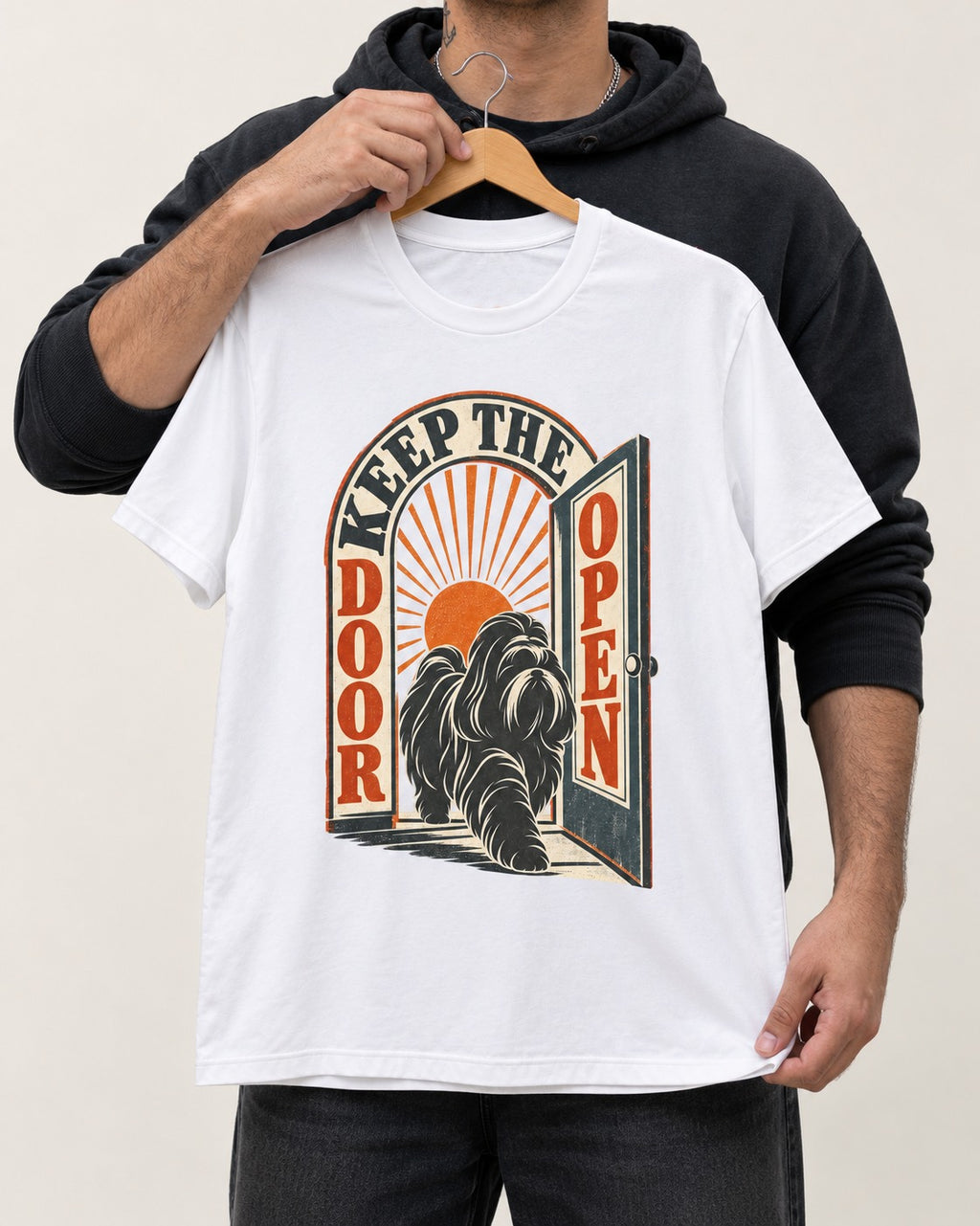 Shih Tzu Keep the Door Open Retro Doorway Graphic T-Shirt in White, held up on a hanger