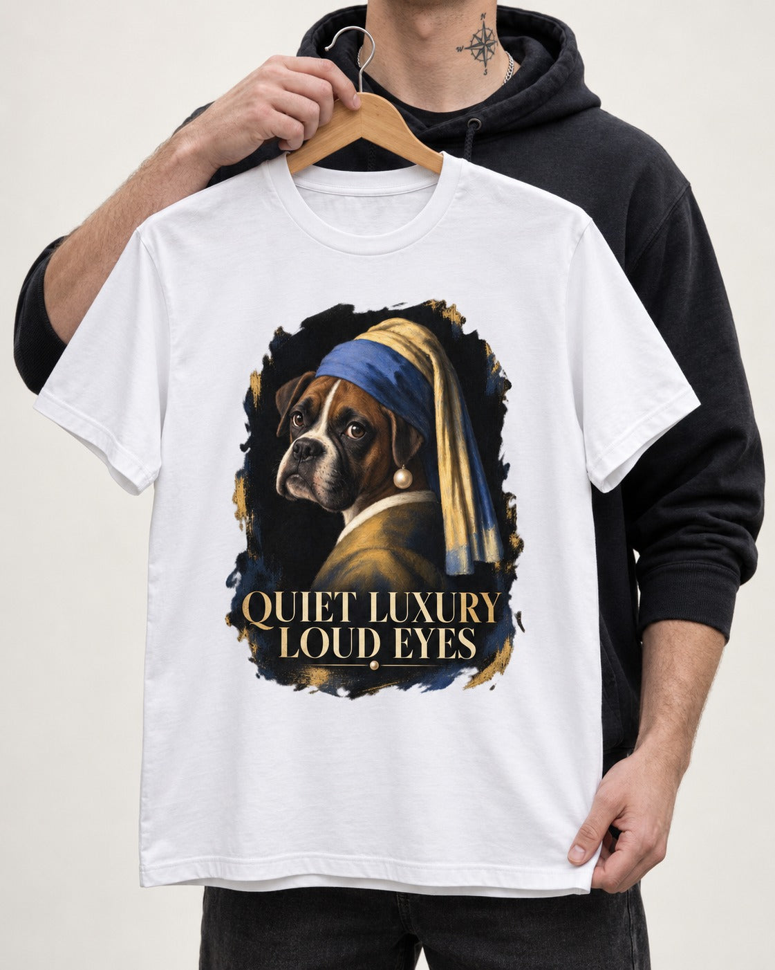 Quiet Luxury Loud Eyes Boxer Pearl Portrait T-Shirt in White, held up on a hanger