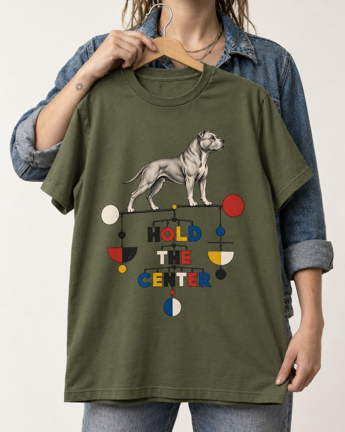 Pitbull Hold the Center Balance Mobile Graphic T-Shirt in Heather Military Green, held up on a hanger