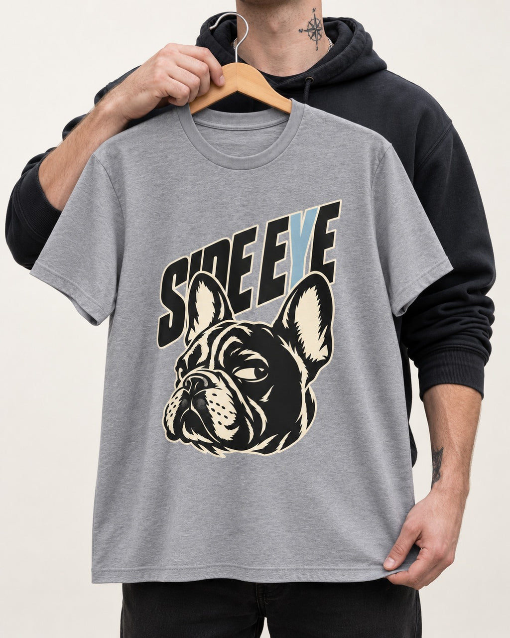 Frenchie Side Eye Portrait Graphic T-Shirt in Sport Grey, held up on a hanger