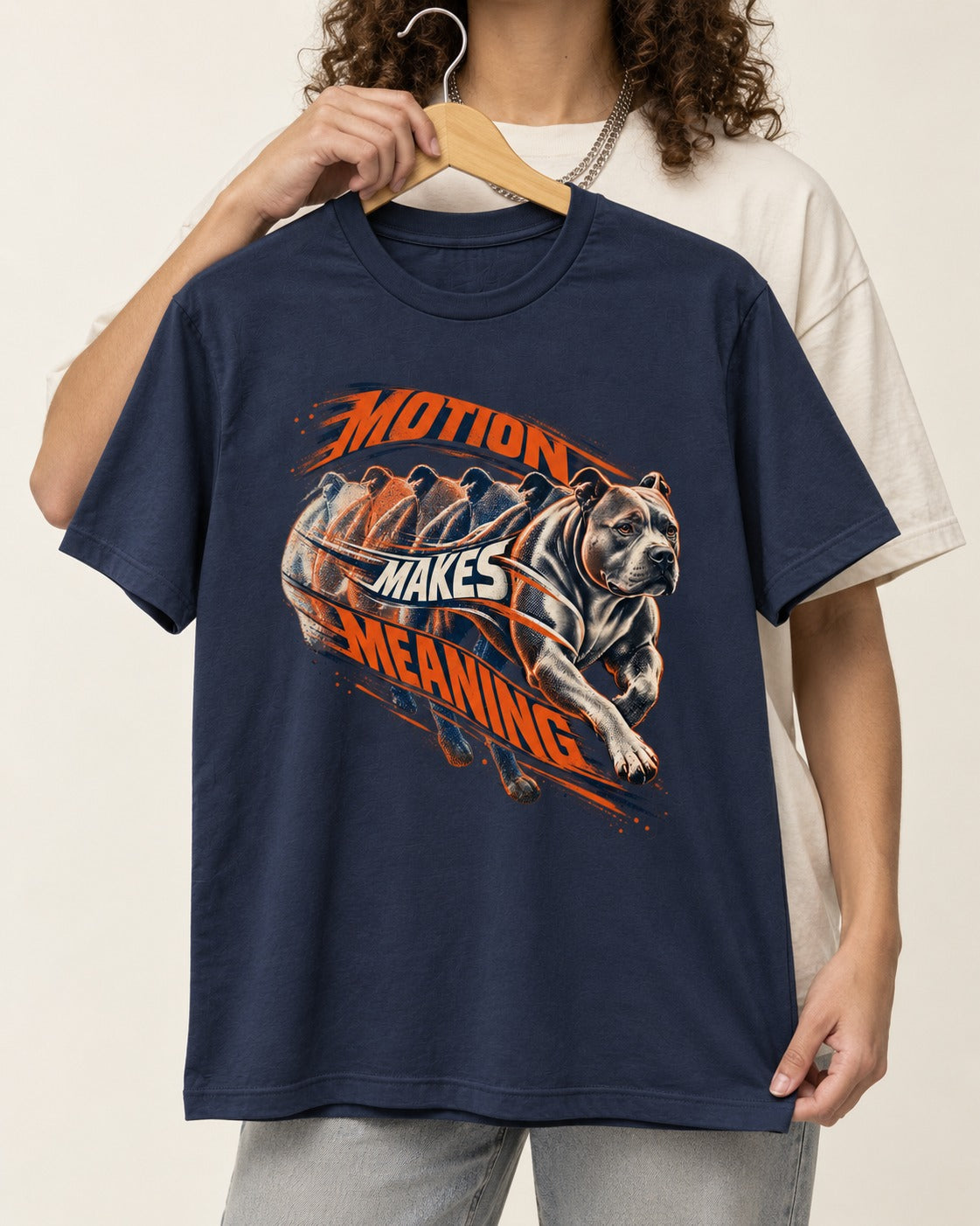 Pitbull Motion Makes Meaning Running Dog Graphic T-Shirt in Navy, held up on a hanger