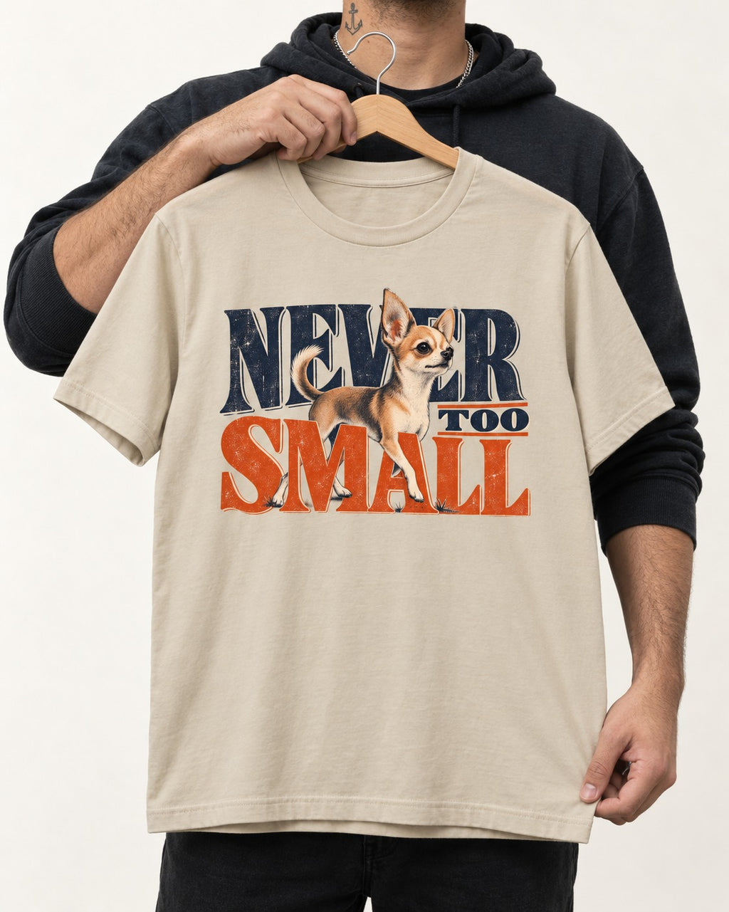 Chihuahua Never Too Small T-Shirt in Sand, held up on a hanger
