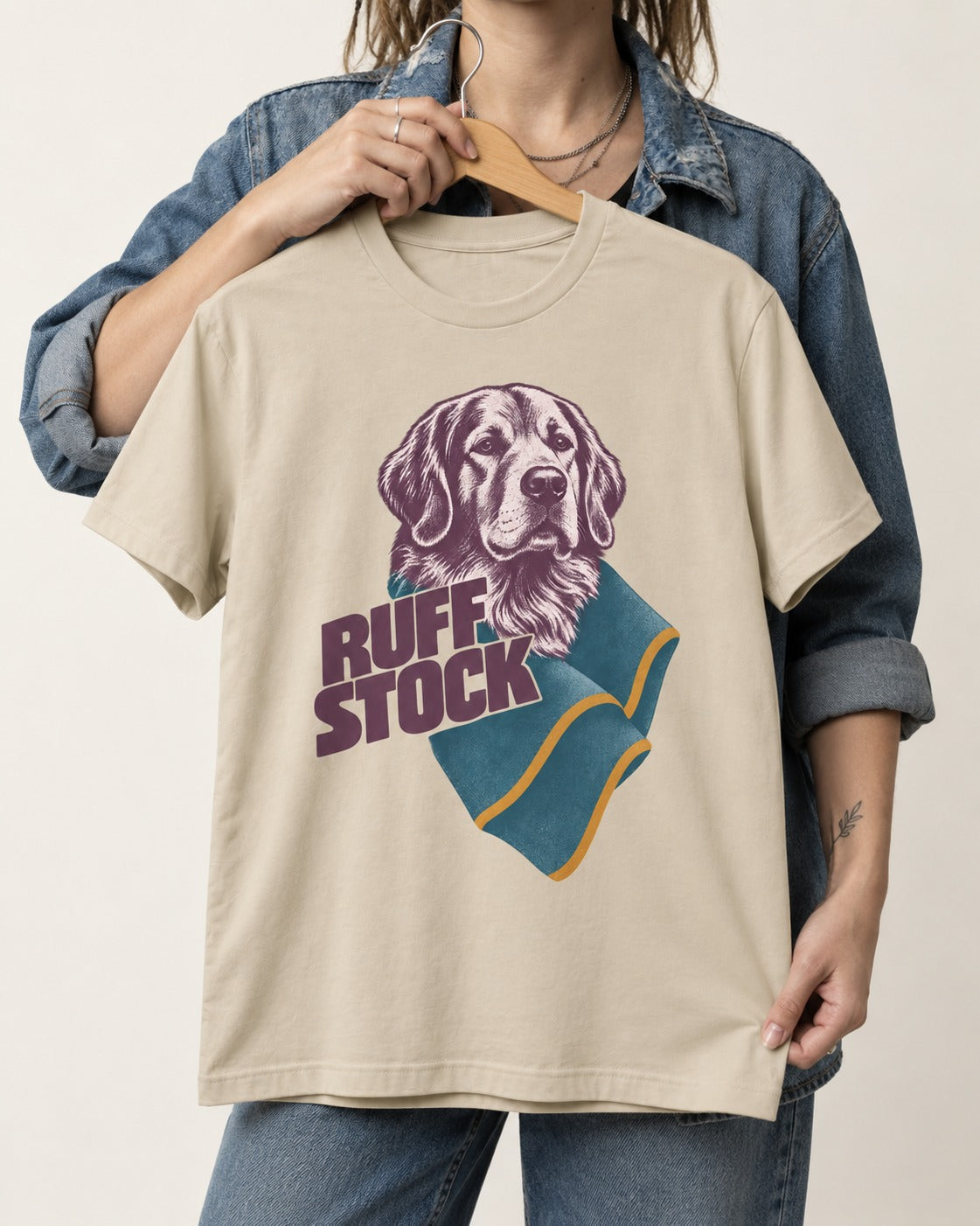 Golden Retriever Ruff Stock T-Shirt in Sand, held up on a hanger