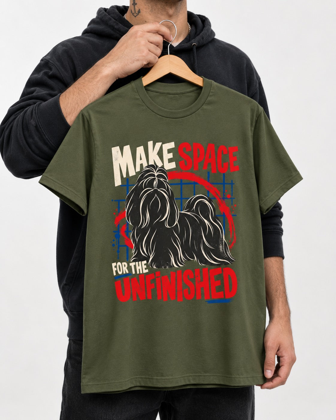 Shih Tzu Make Space for the Unfinished Abstract Circle Graphic T-Shirt in Heather Military Green, held up on a hanger