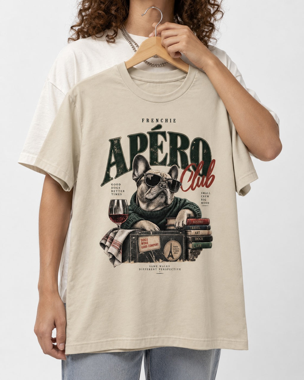 Frenchie Apero Club T-Shirt in Sand, held up on a hanger