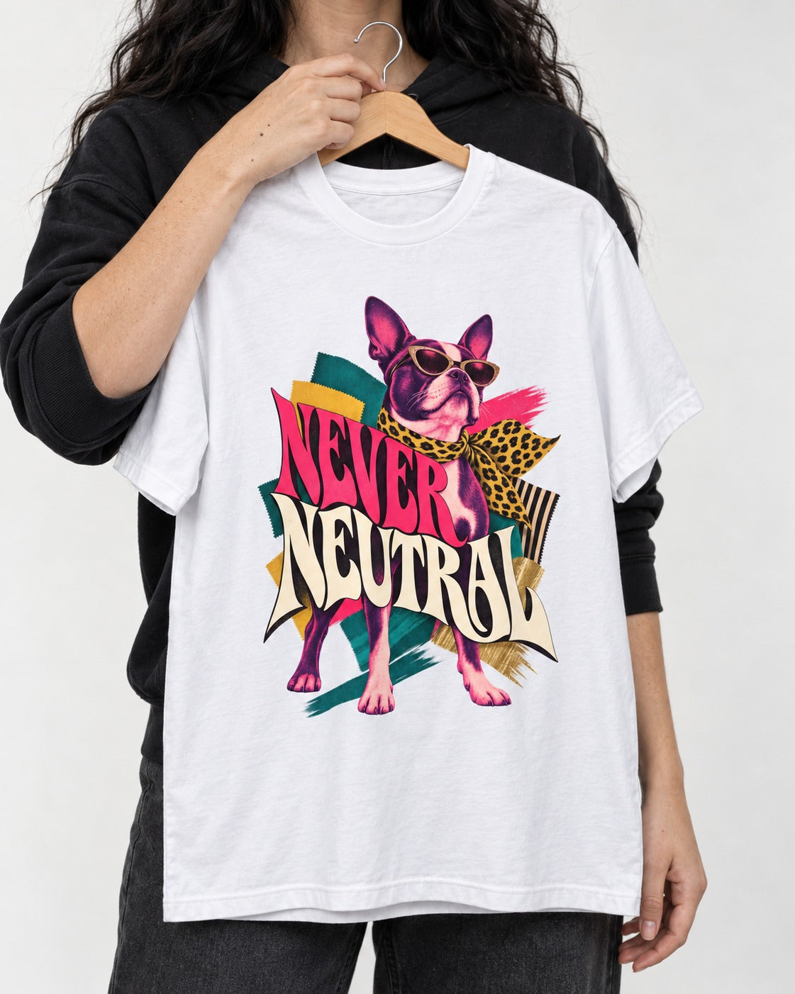 Boston Terrier Never Neutral Fashion Collage Graphic T-Shirt in White, held up on a hanger