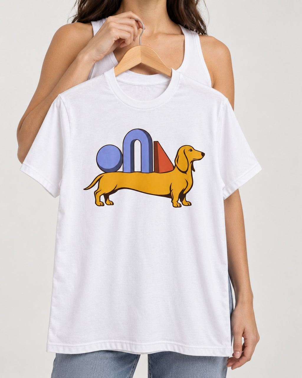 Dachshund Daydream T-Shirt in White, held up on a hanger