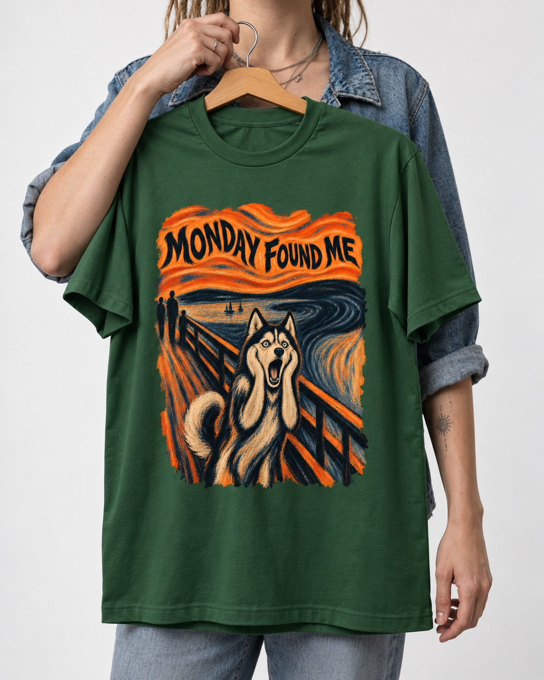 Husky Monday Found Me Scream Parody Graphic T-Shirt in Forest Green, held up on a hanger