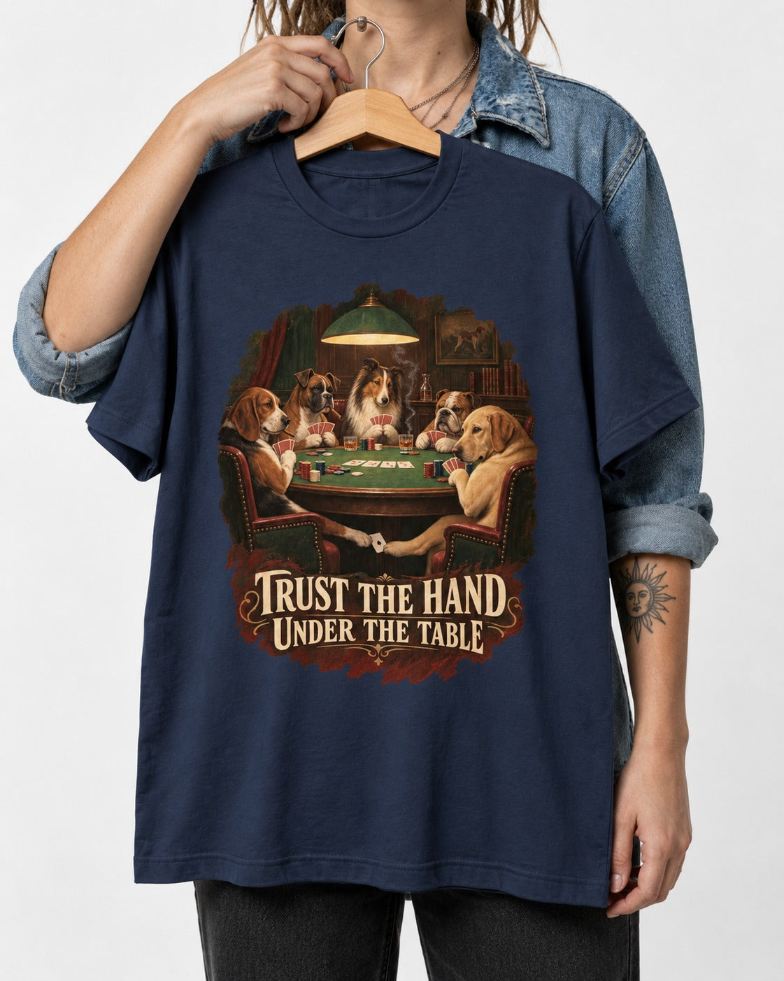 Labrador Retriever Trust the Hand Under the Table Poker Dogs Graphic T-Shirt in Navy, held up on a hanger