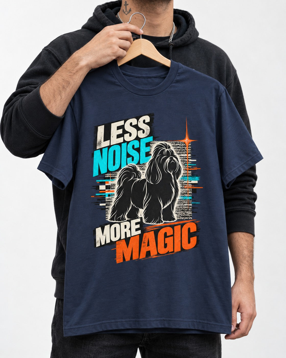 Shih Tzu Less Noise More Magic Pop Art Graphic T-Shirt in Navy, held up on a hanger