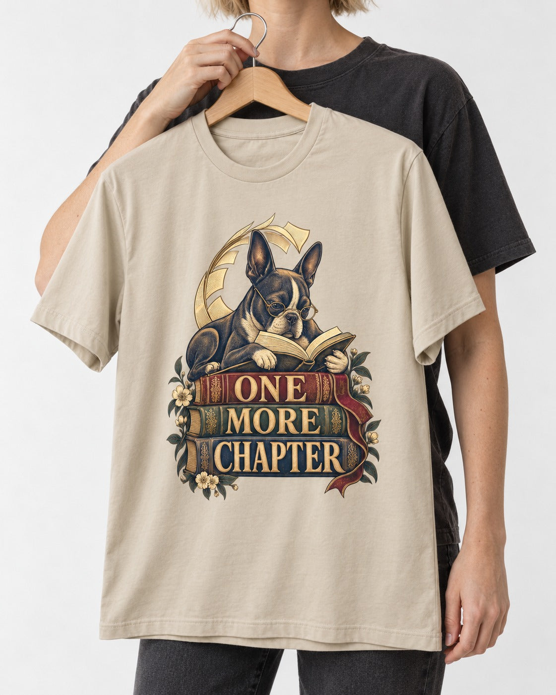 One More Chapter Boston Terrier T-Shirt in Sand, held up on a hanger