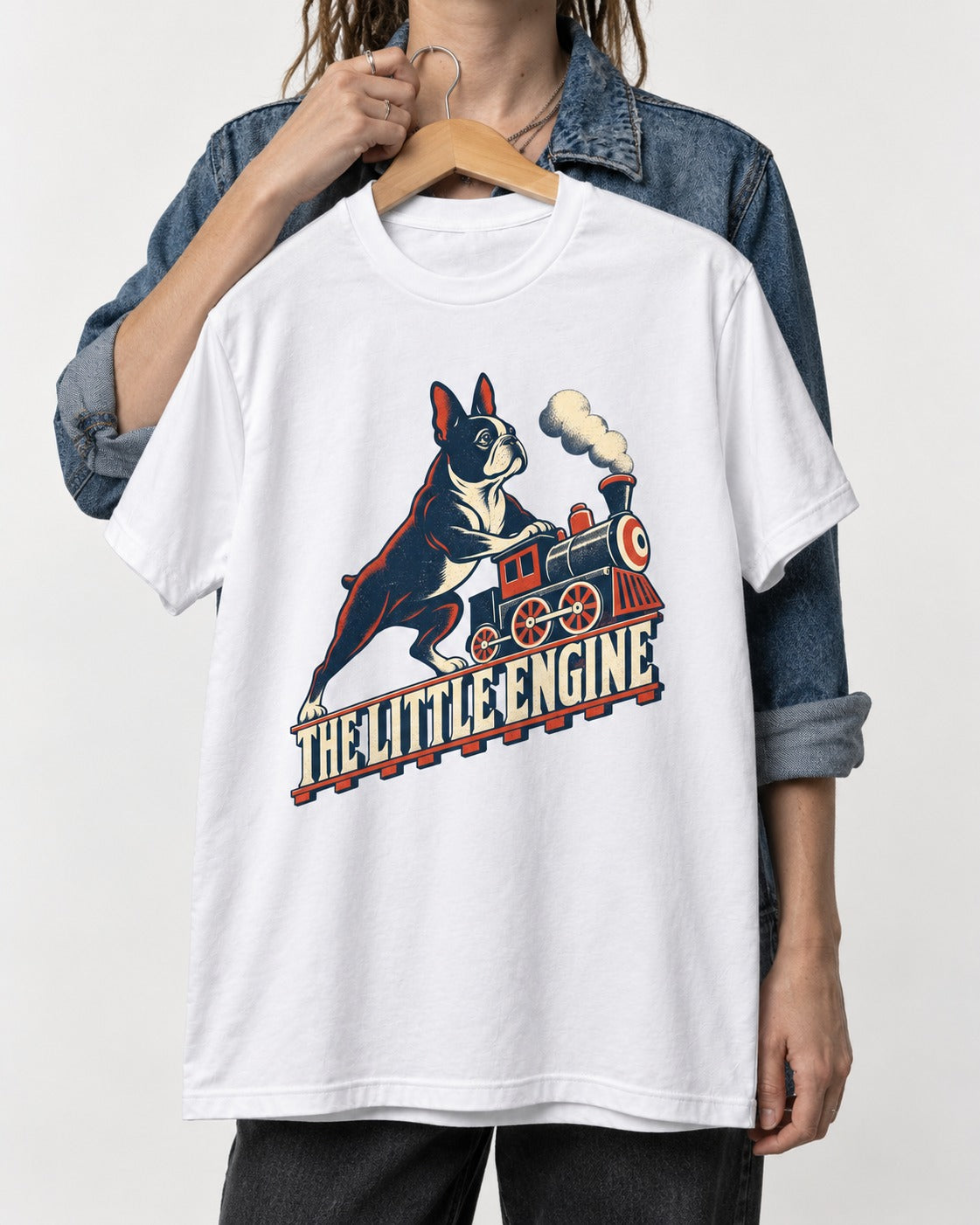 Boston Terrier The Little Engine T-Shirt in White, held up on a hanger