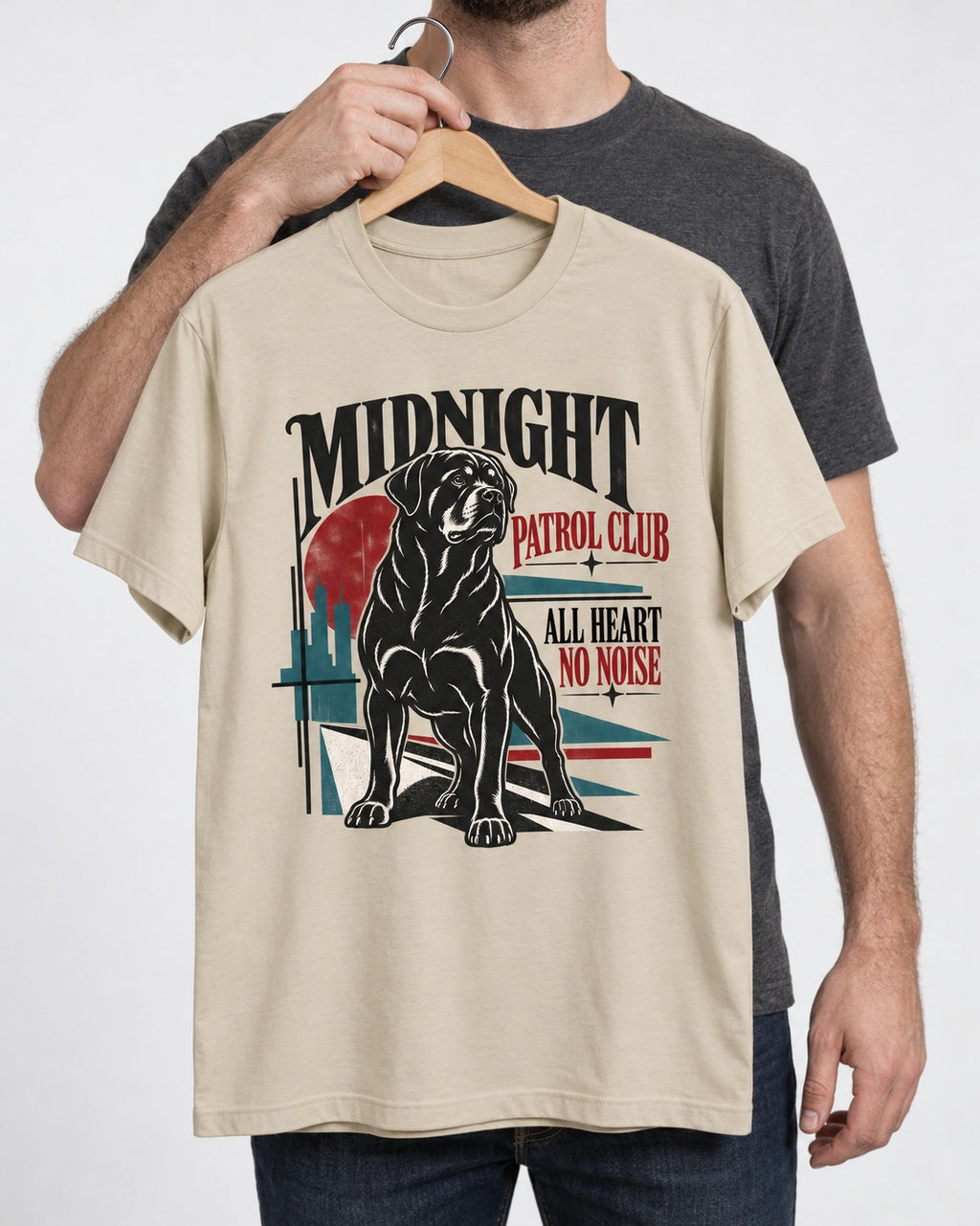 Rottweiler Midnight Patrol Club T-Shirt in Sand, held up on a hanger