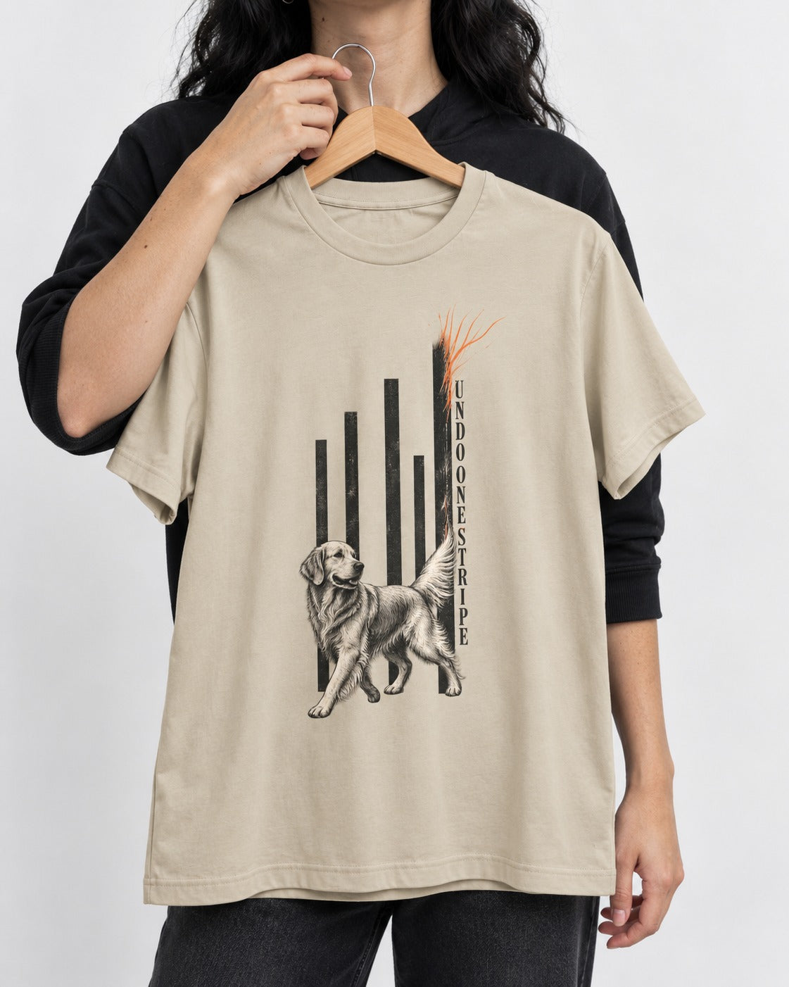 Undo One Stripe Golden Retriever T-Shirt in Sand, held up on a hanger