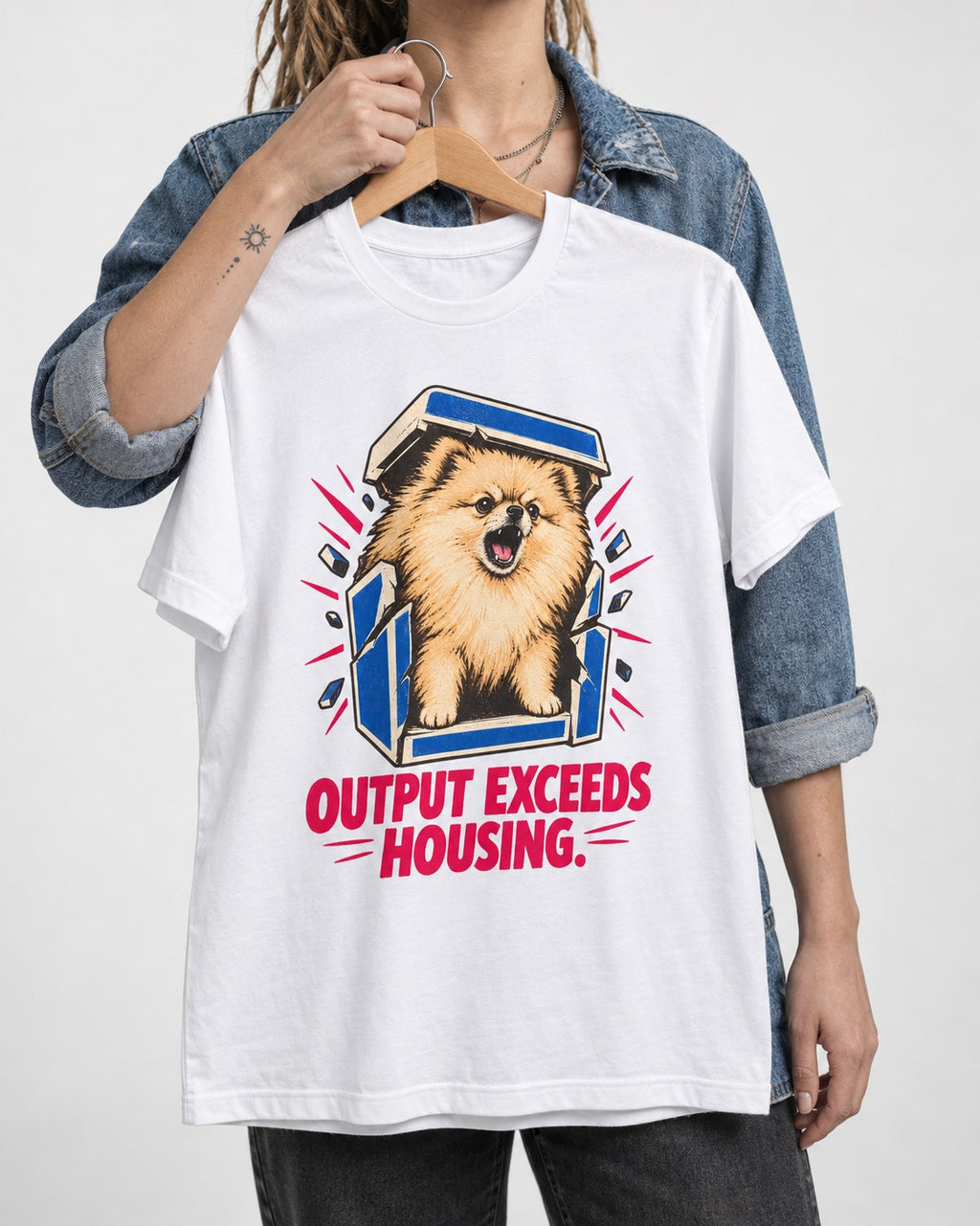 Pomeranian Output Exceeds Housing Bark Compression Graphic T-Shirt in White, held up on a hanger