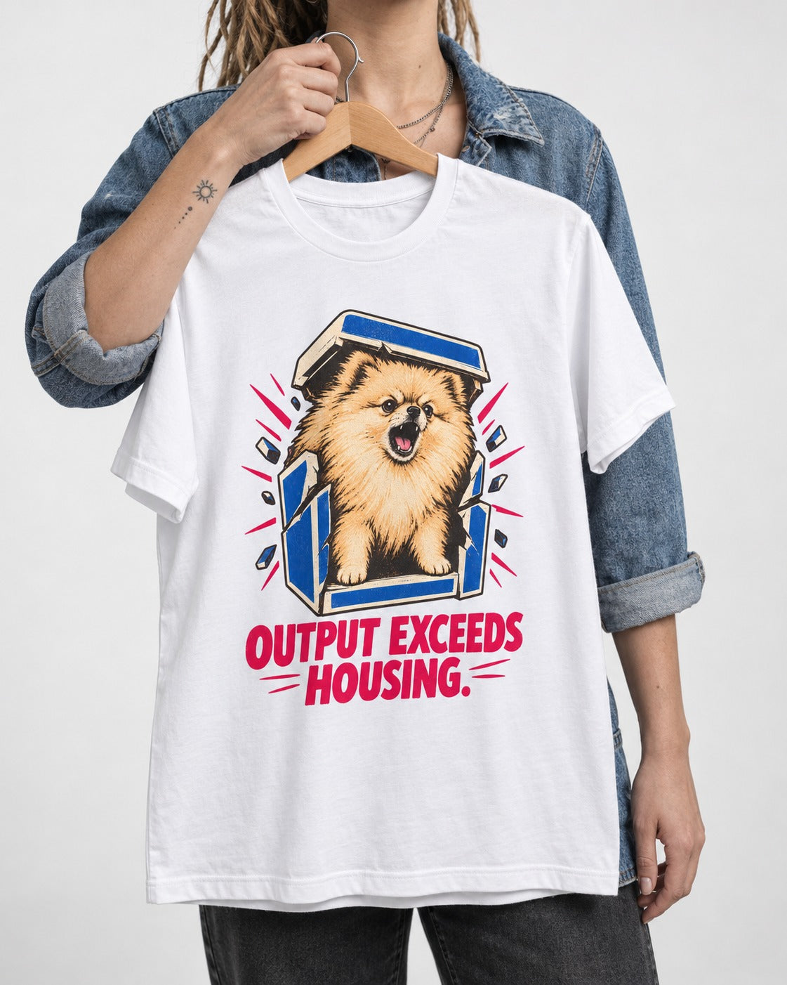 Pomeranian Output Exceeds Housing Bark Compression Graphic T-Shirt in White, held up on a hanger