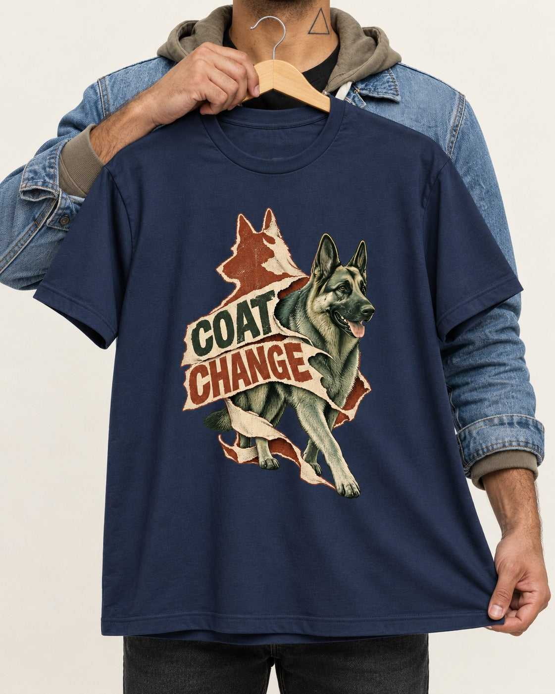 Coat Change Running German Shepherd Dog Ribbon Graphic T-Shirt in Navy, held up on a hanger