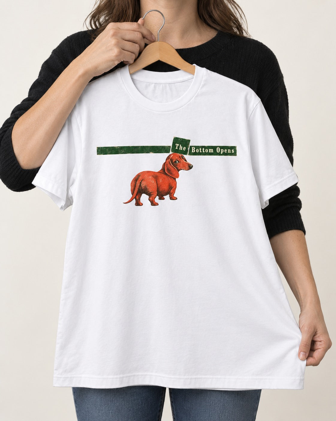 Dachshund The Bottom Opens Signpost Graphic T-Shirt in White, held up on a hanger