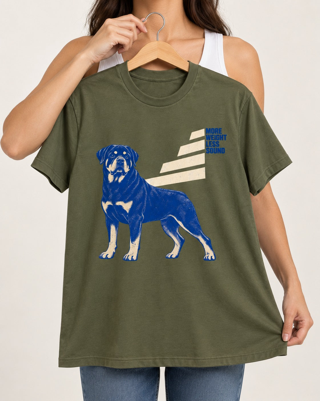 Rottweiler More Weight Less Sound Stair Step Graphic T-Shirt in Heather Military Green, held up on a hanger
