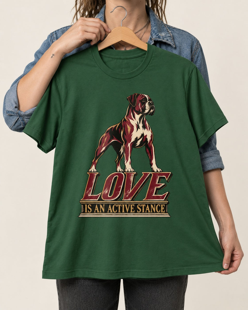 Love Is an Active Stance Boxer Pedestal Graphic T-Shirt in Forest Green, held up on a hanger