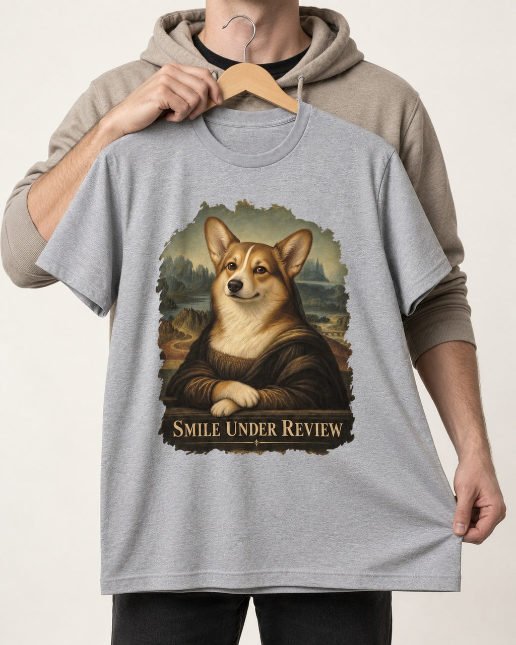 Corgi Smile Under Review Mona Lisa Portrait T-Shirt in Sport Grey, held up on a hanger