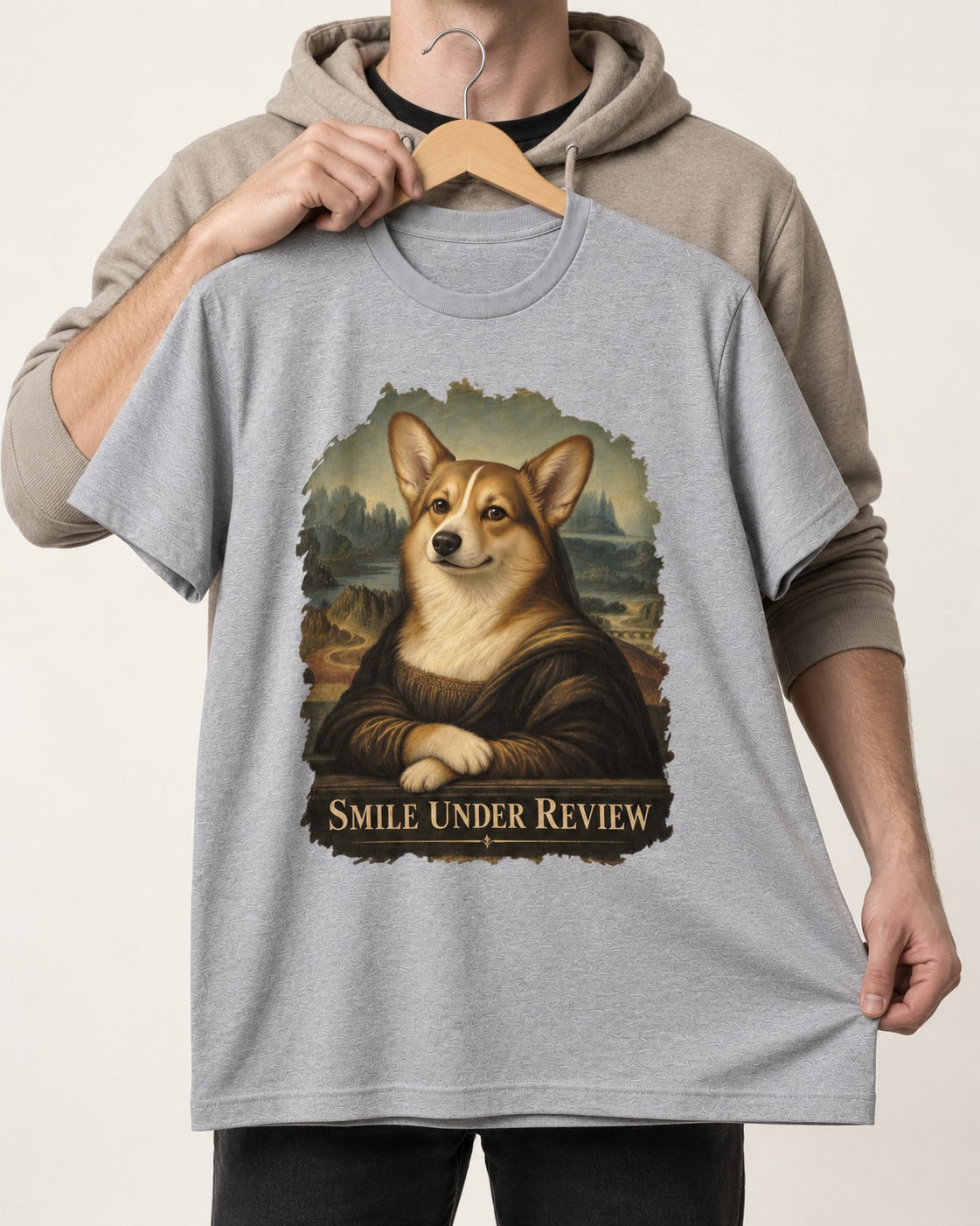 Corgi Smile Under Review Mona Lisa Portrait T-Shirt in Sport Grey, held up on a hanger