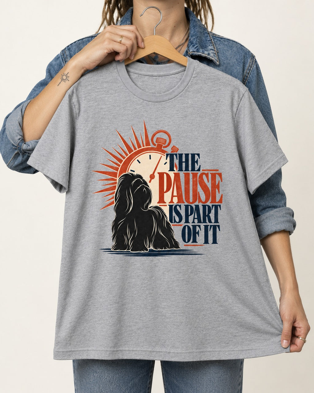 The Shih Tzu Pause T-Shirt in Sport Grey, held up on a hanger