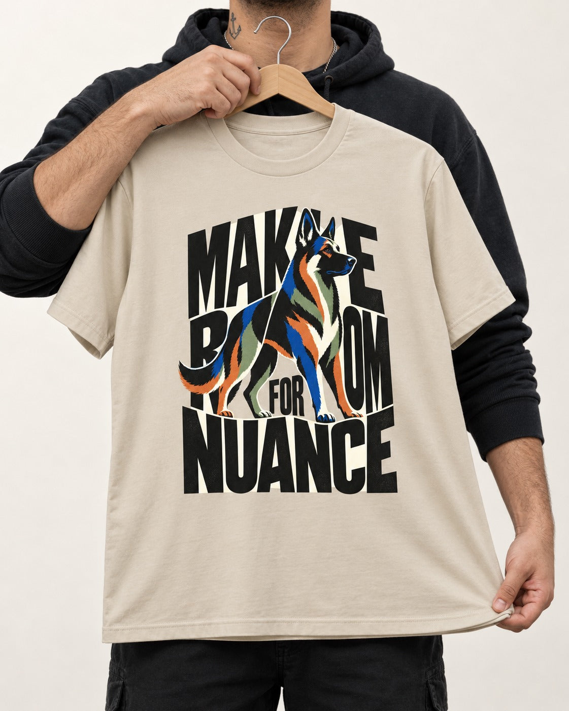 Make Room for Nuance German Shepherd Dog T-Shirt in Sand, held up on a hanger