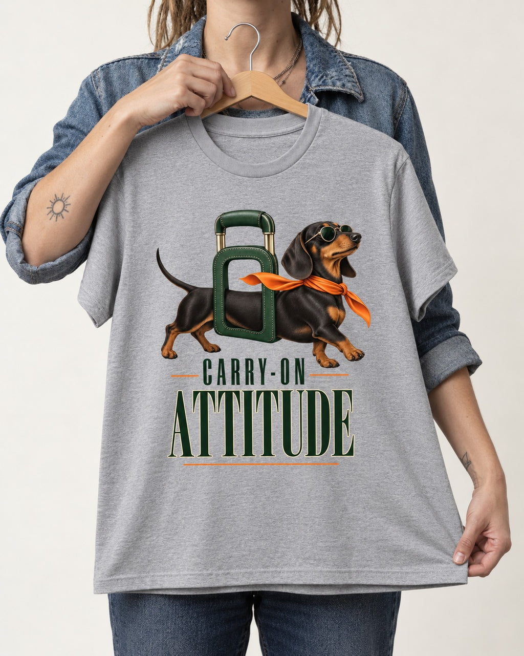 Dachshund Carry on Attitude T-Shirt in Sport Grey, held up on a hanger