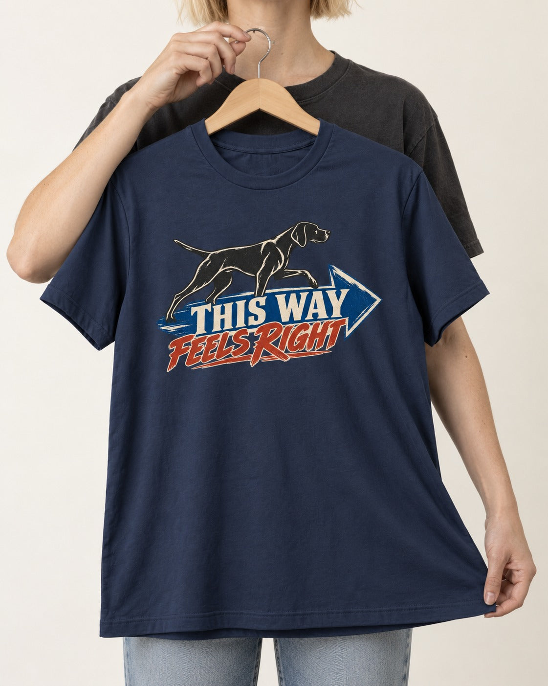 This Way Feels Right Arrow German Shorthaired Pointer Graphic T-Shirt in Navy, held up on a hanger