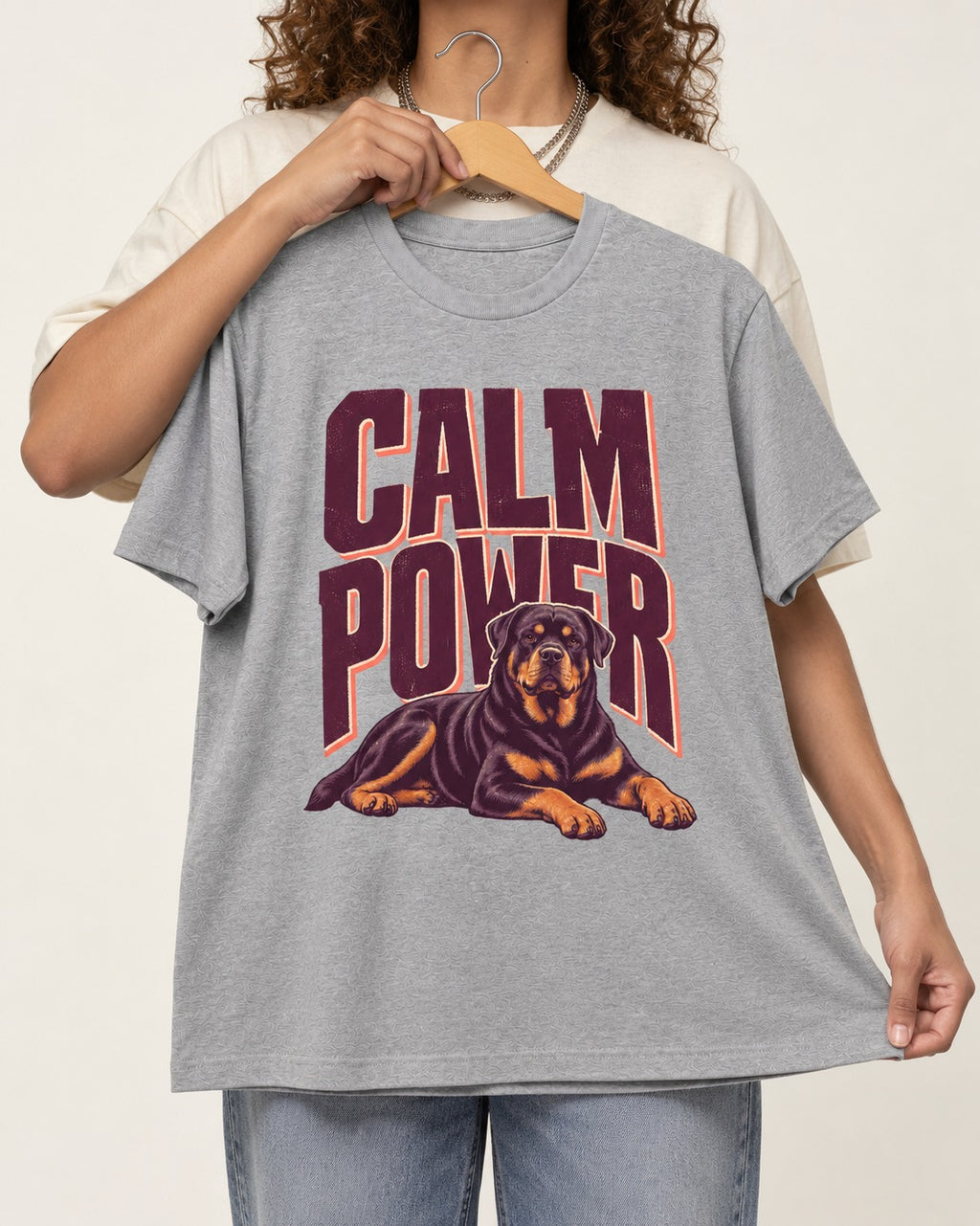 Rottweiler Calm Power Resting Dog Graphic T-Shirt in Sport Grey, held up on a hanger