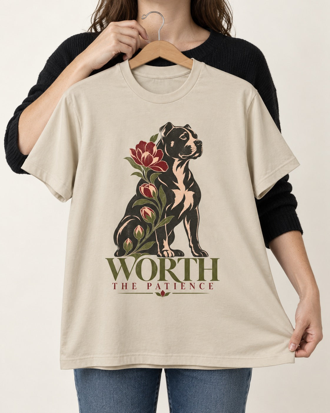 Pitbull Worth the Patience T-Shirt in Sand, held up on a hanger