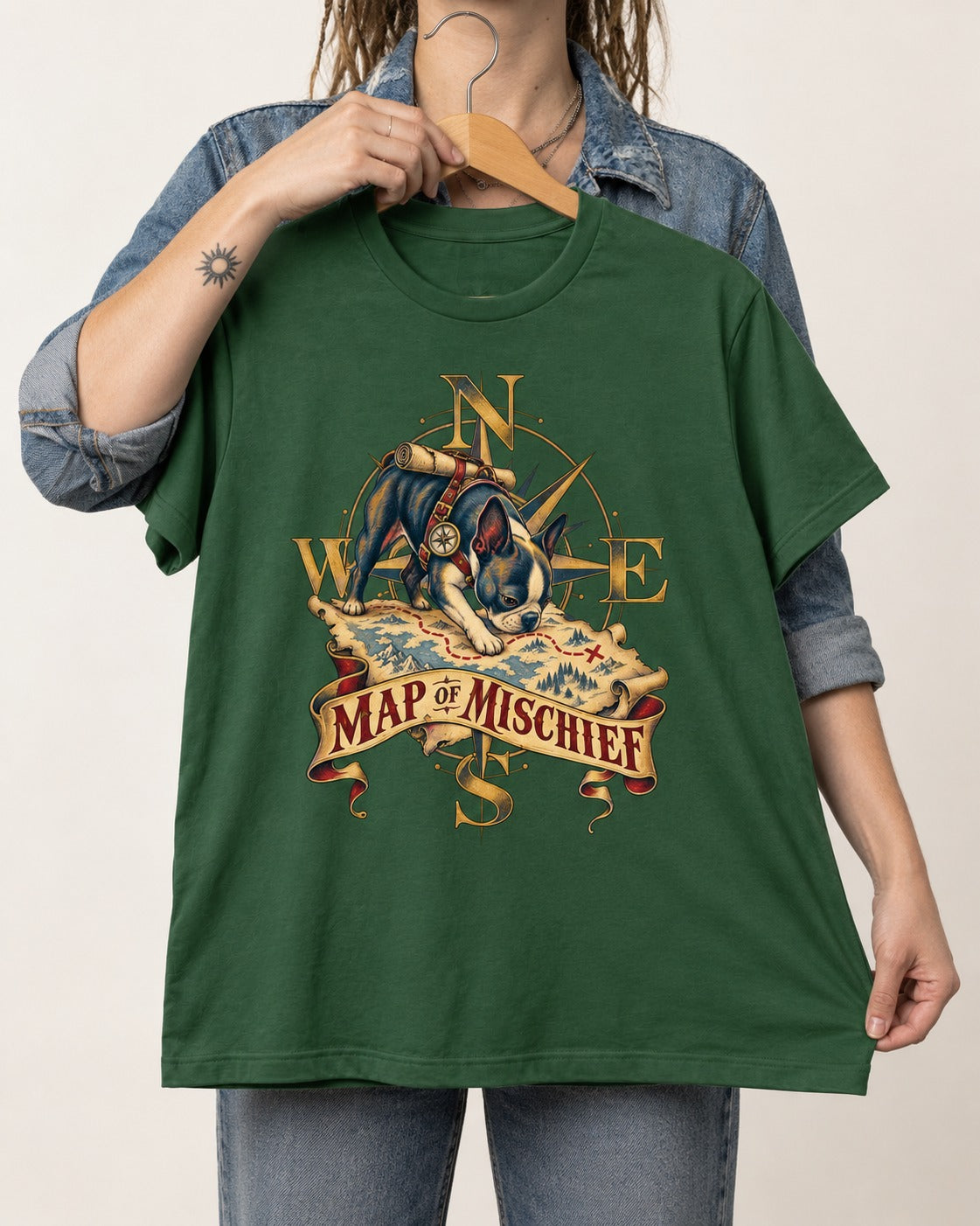 Map of Mischief Boston Terrier T-Shirt in Forest Green, held up on a hanger