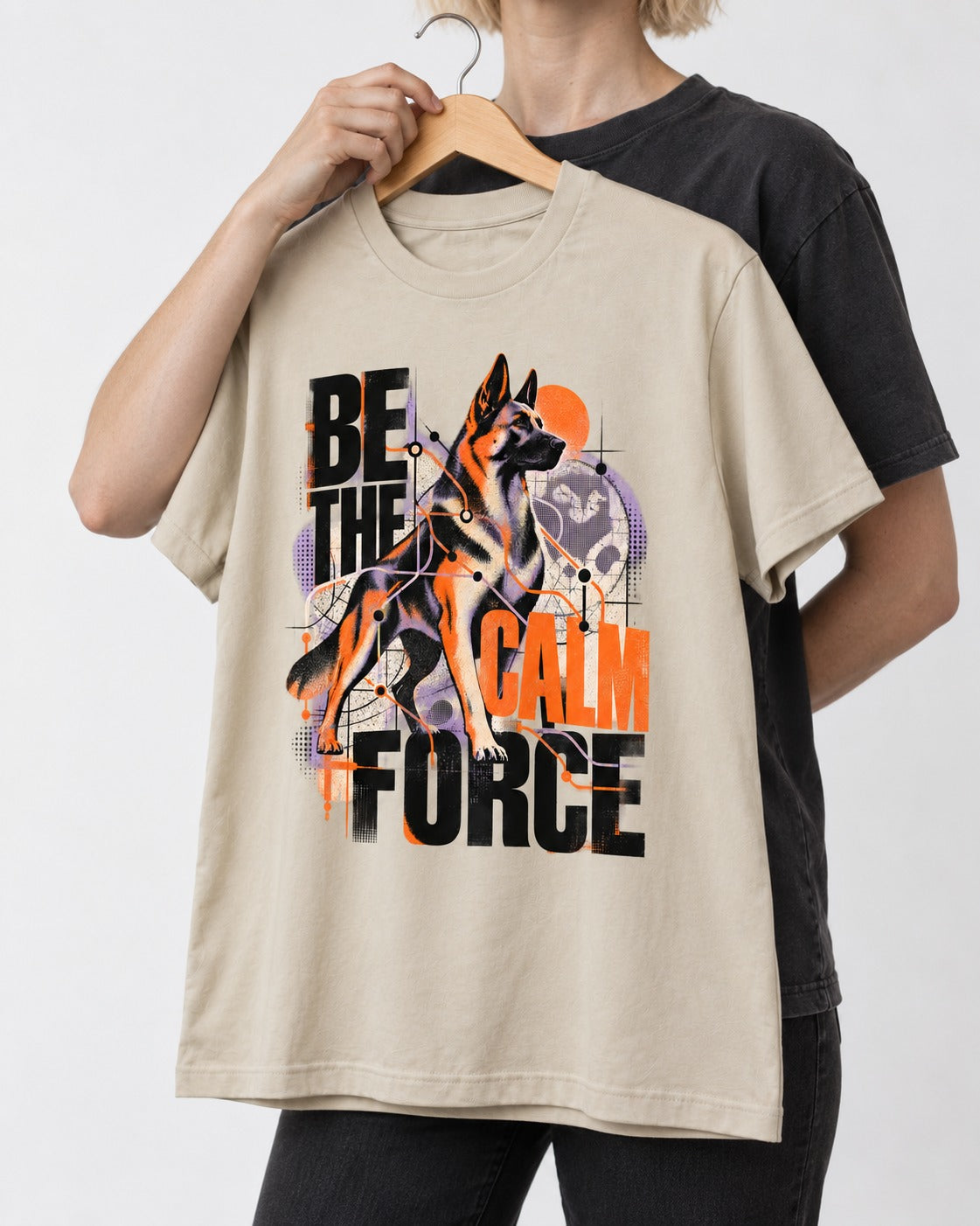 Be the Calm Force German Shepherd Dog T-Shirt in Sand, held up on a hanger