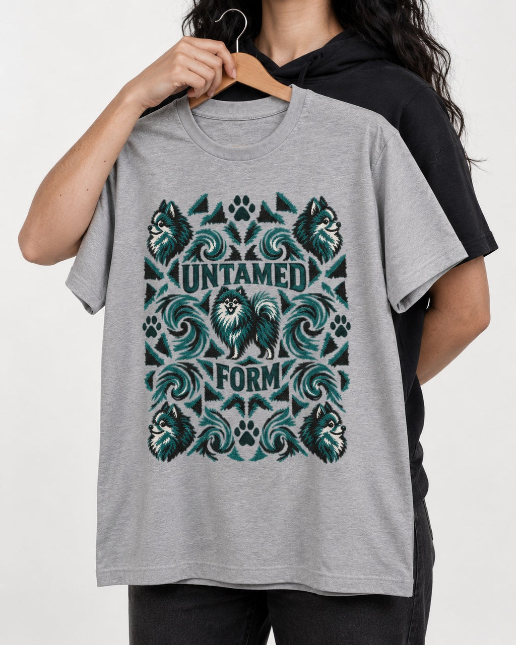 Pomeranian Untamed Form T-Shirt in Sport Grey, held up on a hanger