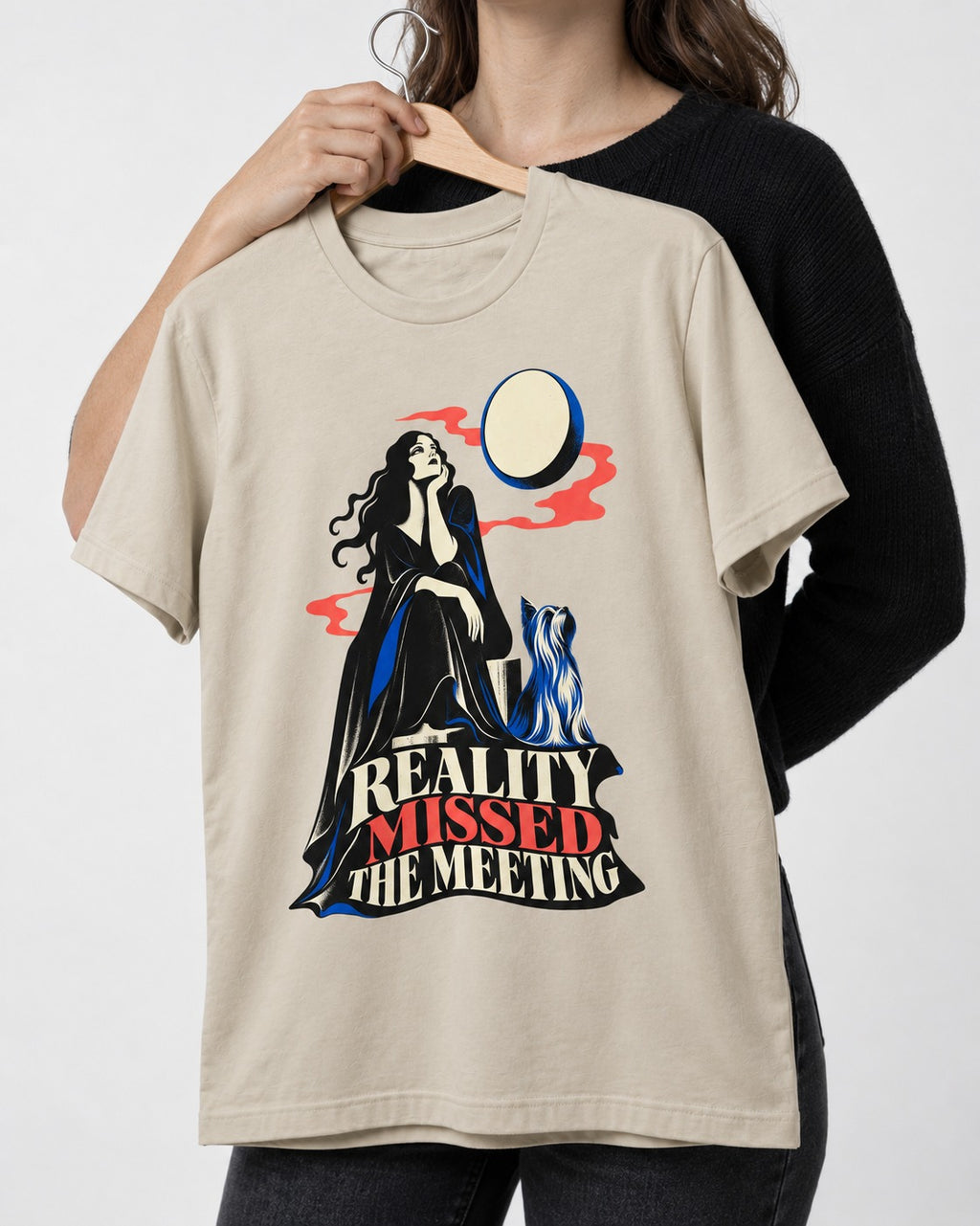 Yorkshire Terrier Reality Missed the Meeting T-Shirt in Sand, held up on a hanger