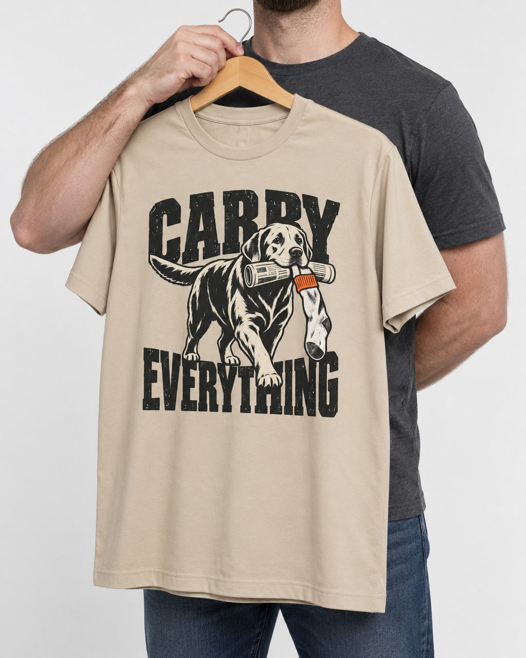 Carry Everything Labrador Retriever T-Shirt in Sand, held up on a hanger