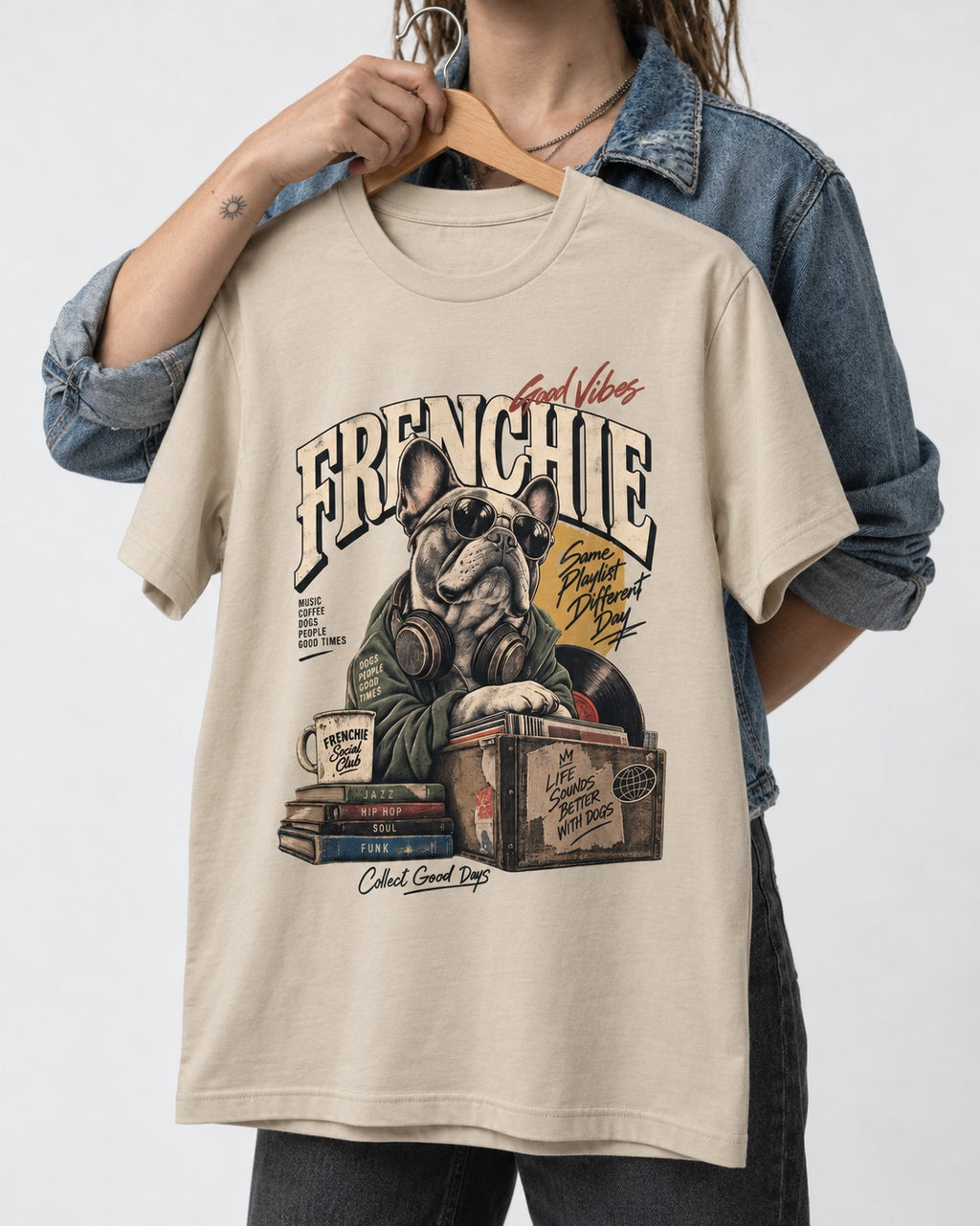 Frenchie Social Club T-Shirt in Sand, held up on a hanger
