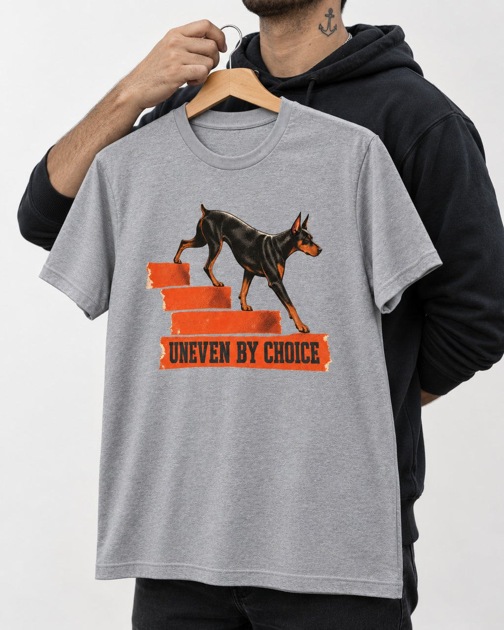 Doberman Uneven by Choice Stair Graphic T-Shirt in Sport Grey, held up on a hanger