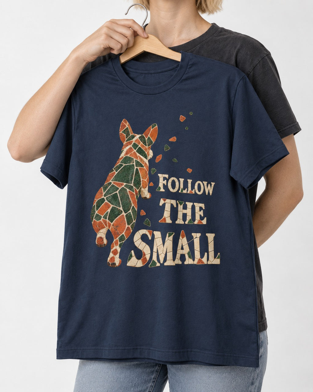 Corgi Follow the Small Mosaic T-Shirt in Navy, held up on a hanger