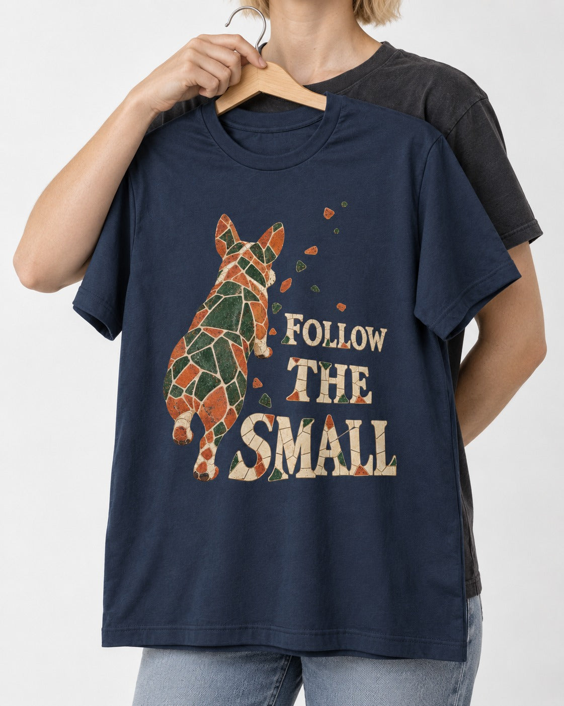 Corgi Follow the Small Mosaic T-Shirt in Navy, held up on a hanger