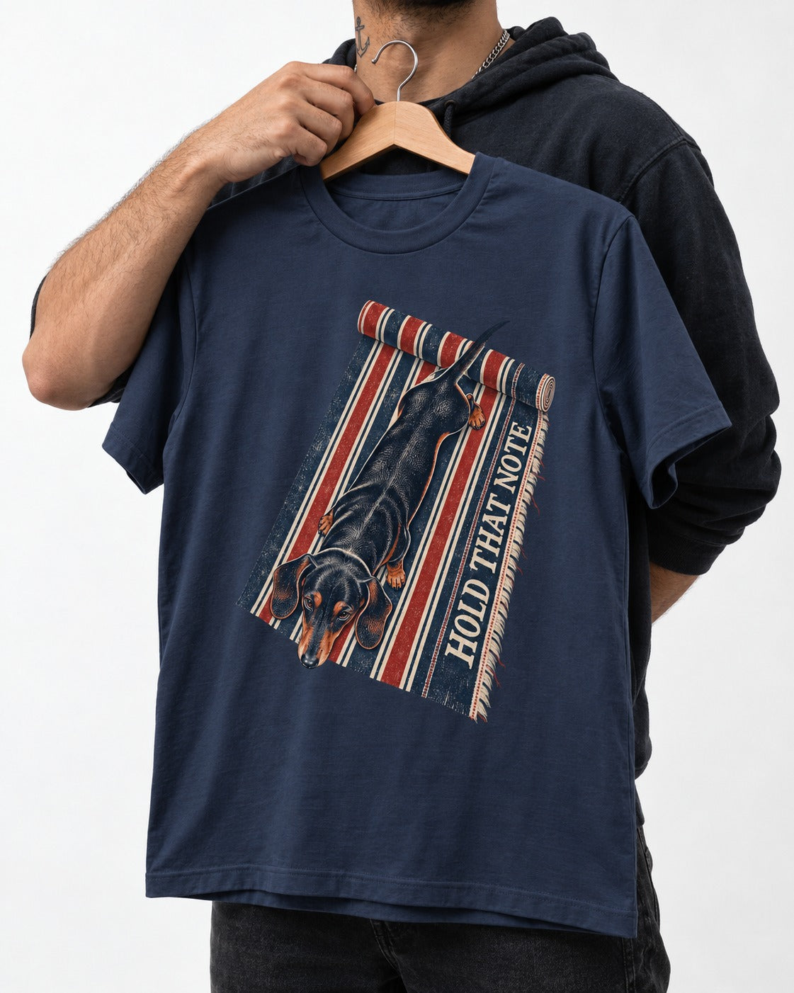 Dachshund Hold That Note Striped Rug Graphic T-Shirt in Navy, held up on a hanger