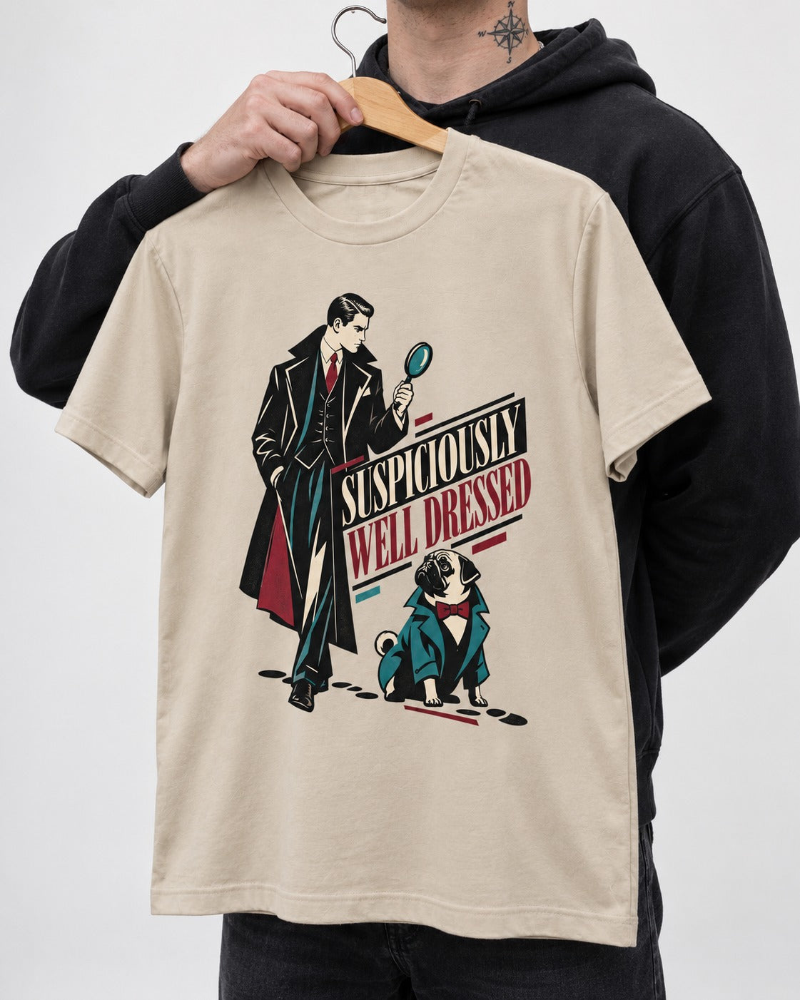 Suspiciously Well Dressed Pug T-Shirt in Sand, held up on a hanger