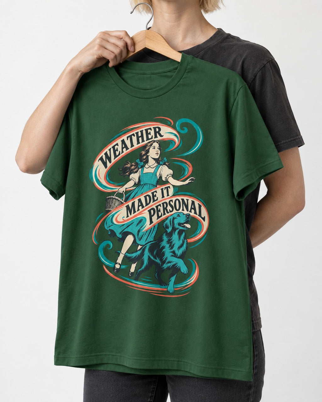 Golden Retriever Weather Made It Personal Woman Graphic T-Shirt in Forest Green, held up on a hanger